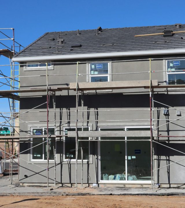 Scaffolding surrounds a new home under construction in Elk Grove, California.